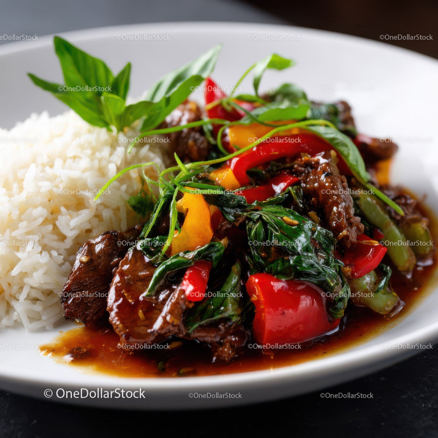 Colorful Beef and Vegetable Stir-Fry with Rice and Fresh Herbs