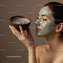 Woman Applying Clay Face Mask During Spa Treatment