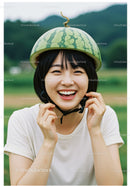 Young woman laughing with watermelon helmet outdoors