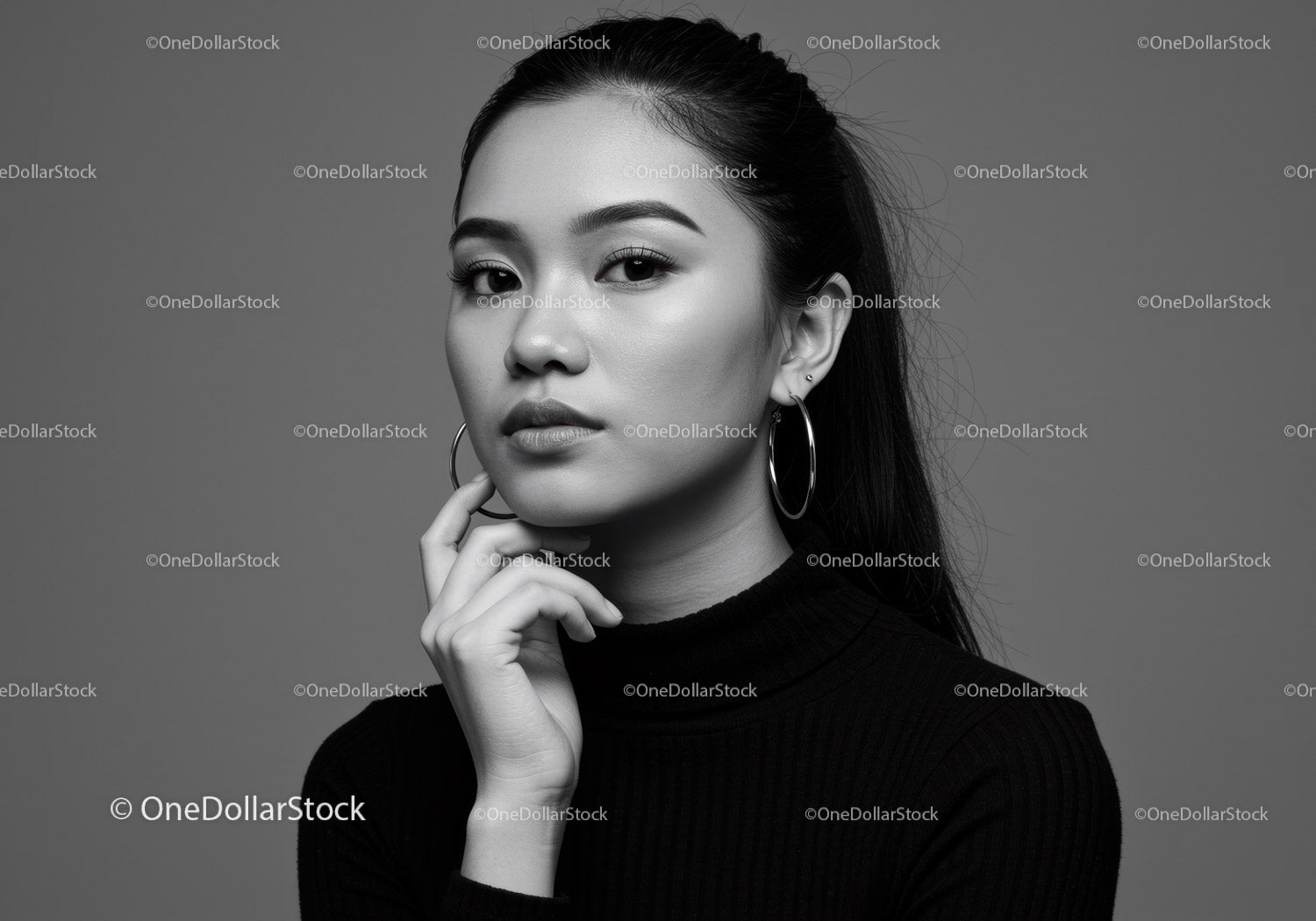 Elegant Young Woman Portrait with Hoop Earrings in Black and White