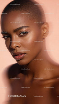 Close-up portrait of confident young woman with glowing skin