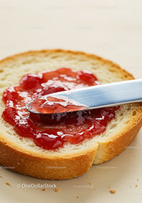 Fresh Bread Slice with Glossy Strawberry Jam Spread