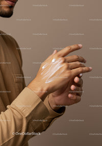 Close-up of Hands Applying Body Lotion for Skin Care and Moisturization