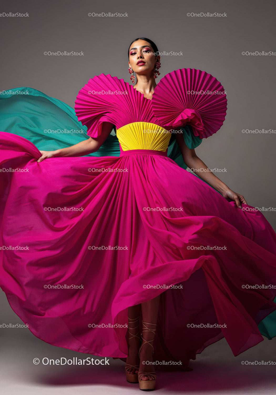 Fashion Model in Vibrant Pink and Yellow Flowing Gown