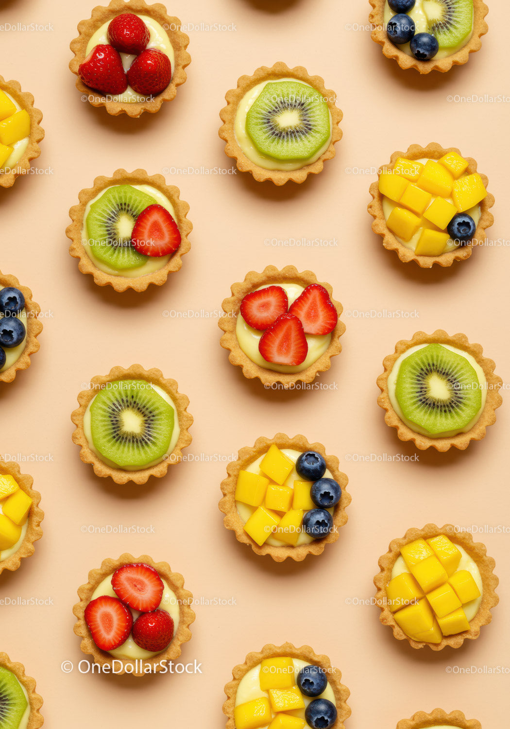 Colorful mini fruit tarts with kiwi strawberry mango
