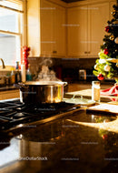 Steaming pot on stove in festive cozy kitchen