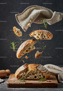 Freshly Baked Artisan Bread with Flying Crumbs