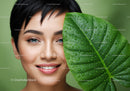 Fresh Green Leaf with Water Droplets Behind Smiling Woman