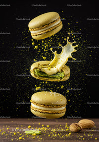 Yellow Pistachio Macarons with Cream Splash on Black