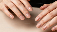 Close-up of feminine hands with natural beige manicure