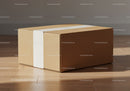 Closed cardboard box with white label on wooden floor