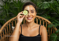 Beautiful Woman with Facial Mask Holding Cucumber in Natural Setting