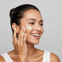 Young Woman Applying Facial Moisturizer for Healthy Glowing Skin