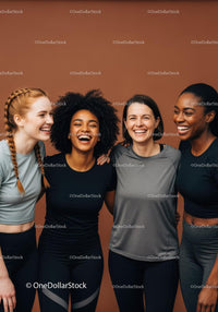 Diverse young women smiling together in sportswear