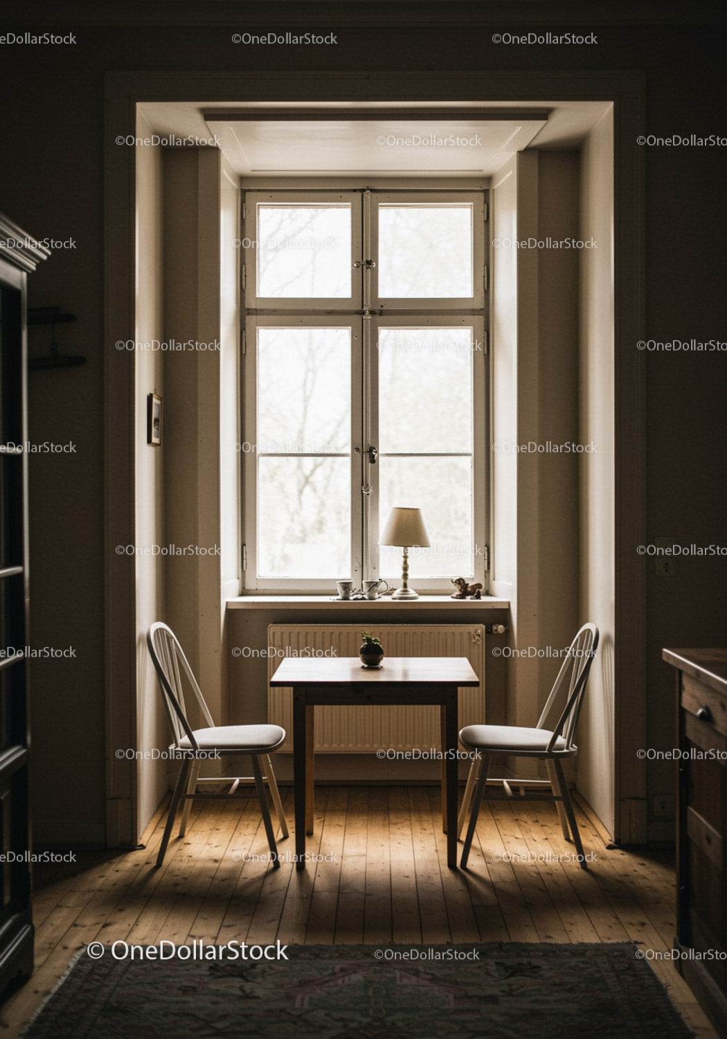 Cozy interior with window and two chairs in warm light