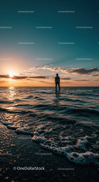 Silhouette of person watching serene ocean sunset