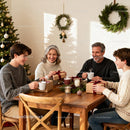 Family enjoying cozy Christmas gift exchange at home