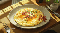 Sunny Side Up Egg with Bacon Bits on a White Plate