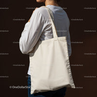 Person Carrying Plain Canvas Tote Bag on Shoulder