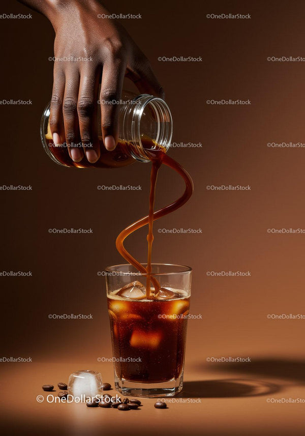 Hand Pouring Cold Brew Coffee Over Ice Cubes