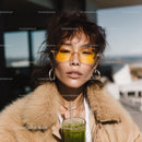 Stylish Woman in Fur Coat and Yellow Sunglasses on Rooftop