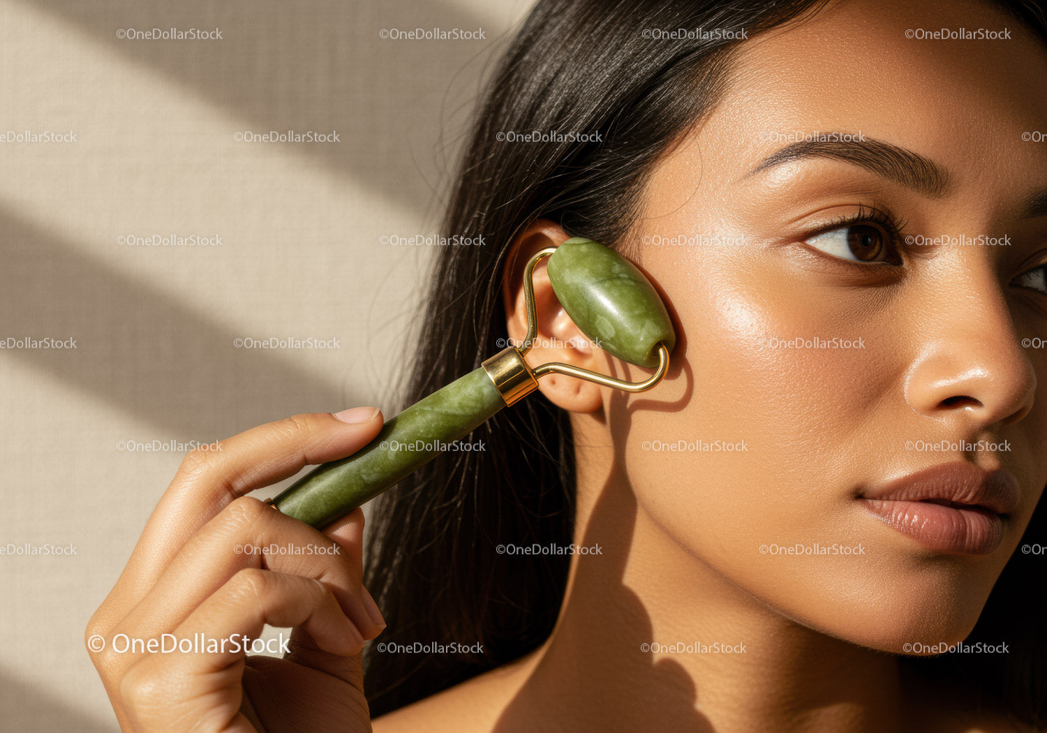 Woman Using Jade Roller for Facial Rejuvenation and Skin Care