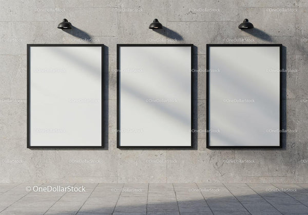 Three Blank Frames on Concrete Wall with Industrial Lamps JPG Mockup Image