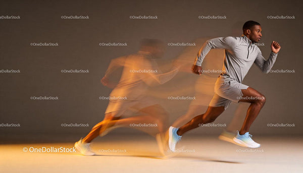Athlete Sprinting with Motion Blur on Gray Background