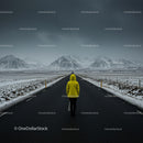 Lonely Traveler in Yellow Jacket on Snow-Covered Road
