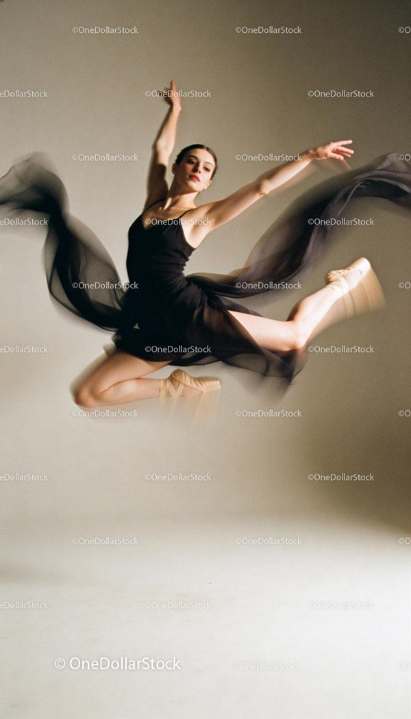 Graceful ballerina mid-air showcasing elegant dance leap