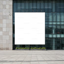 Large blank billboard on modern office building facade