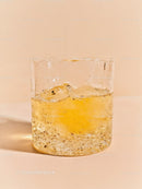 Refreshing cold drink with lemon in clear glass