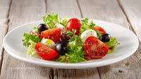 Fresh Vegetable Salad with Cherry Tomatoes Black Olives and Mozzarella