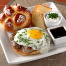 Sunny Side Up Egg on Beef Patty with Toast and Sauces in White Plate