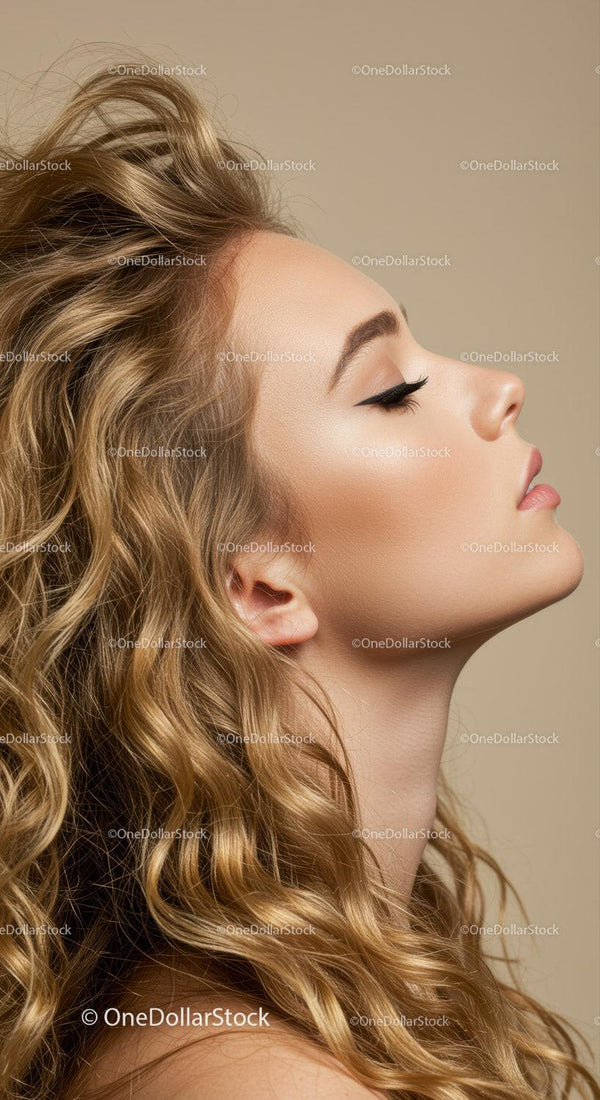 Profile of serene young woman with flowing curly hair