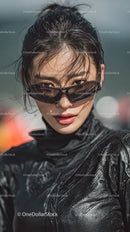 Stylish Woman in Black Outfit with Sunglasses Outdoors