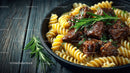 Hearty Beef Stew on Fusilli Pasta with Fresh Rosemary in Rustic Setting