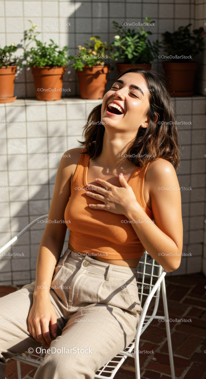 Happy Woman Laughing Outdoors in Sunlight Wearing Casual Fashion