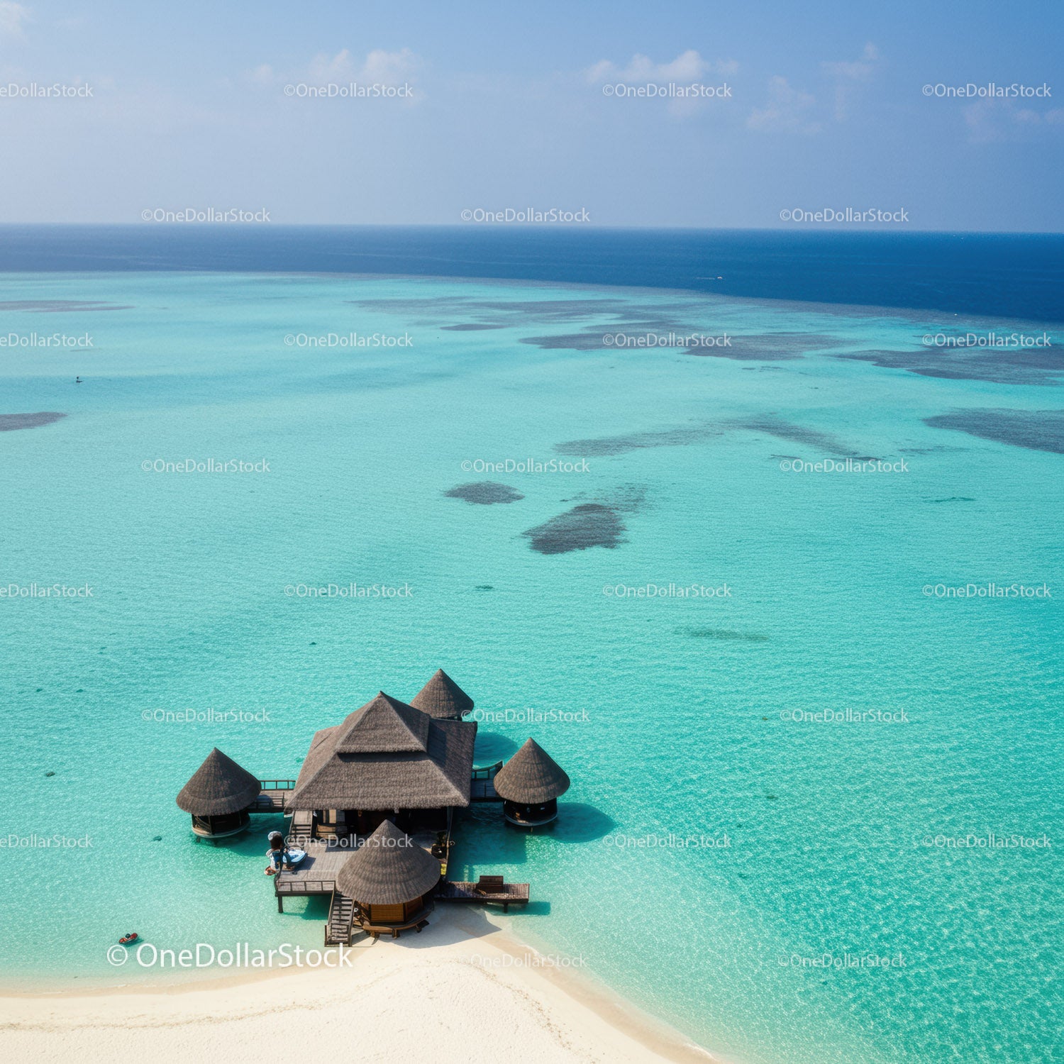 Overwater Bungalows on Tropical Ocean with Clear Turquoise Water