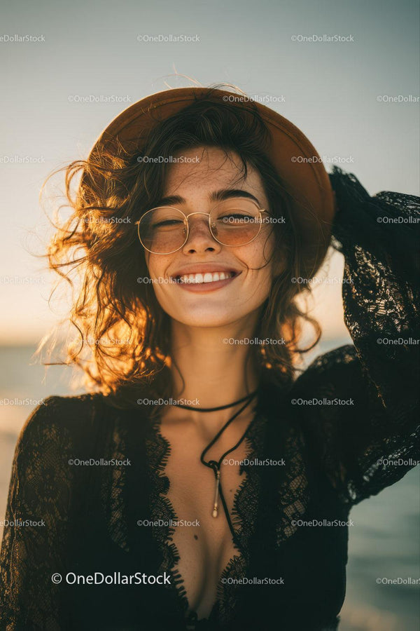 Young Woman Smiling at Sunset on the Beach in Stylish Summer Outfit