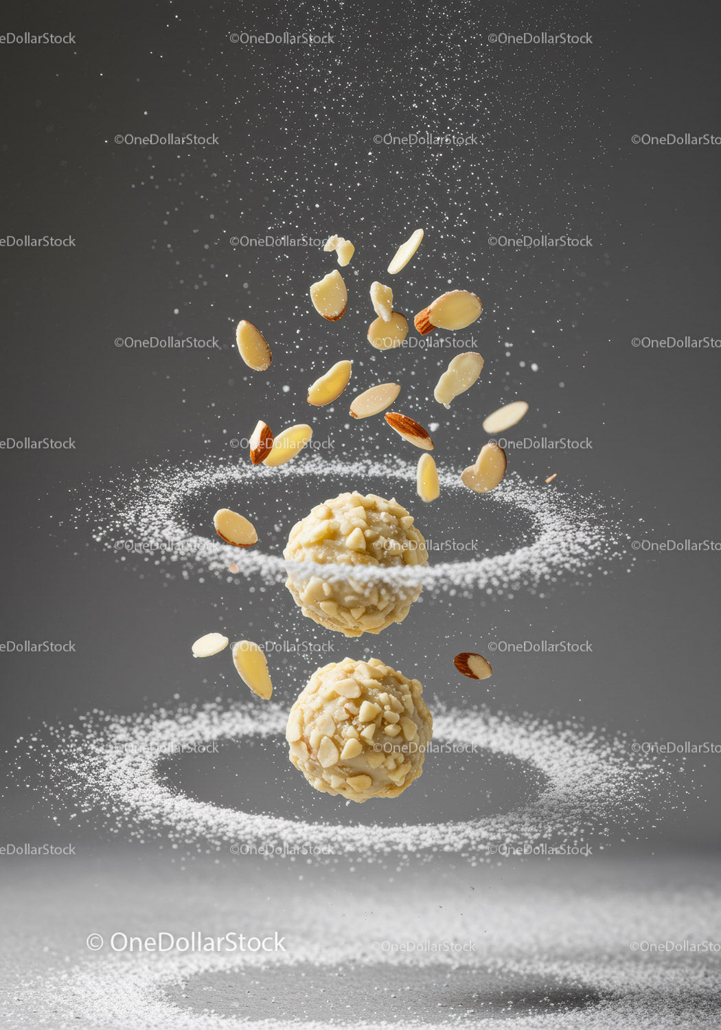 Almond coated truffles with flying nut slices and powdered sugar