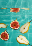 Fresh fig and pear slices submerged in clear water