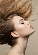 Young woman with flowing hair and serene expression