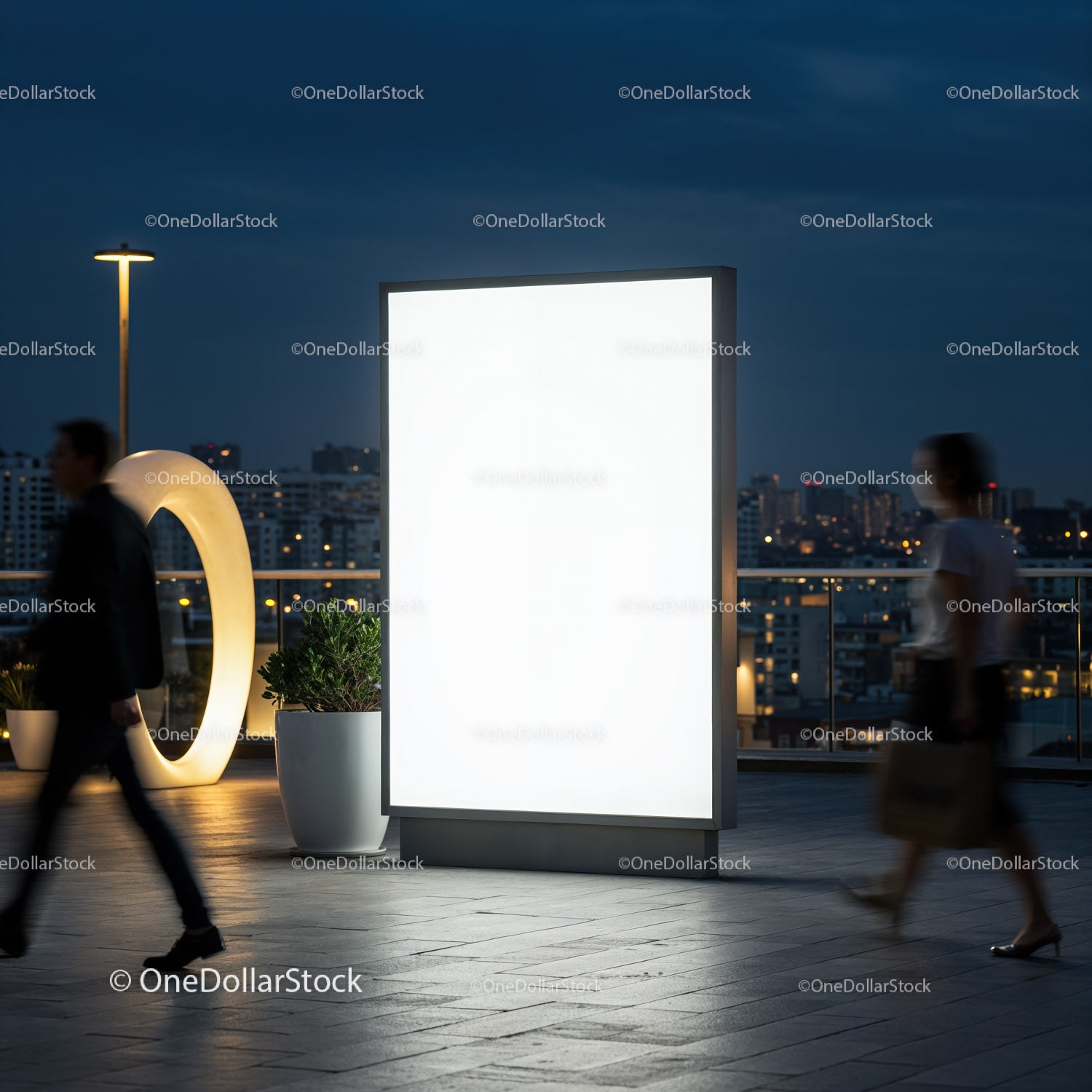 Illuminated Urban Billboard at Night with People Passing By