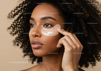 Beautiful woman applying under eye patch in skincare routine