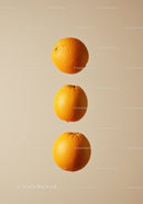 Three Fresh Oranges Floating on Neutral Background