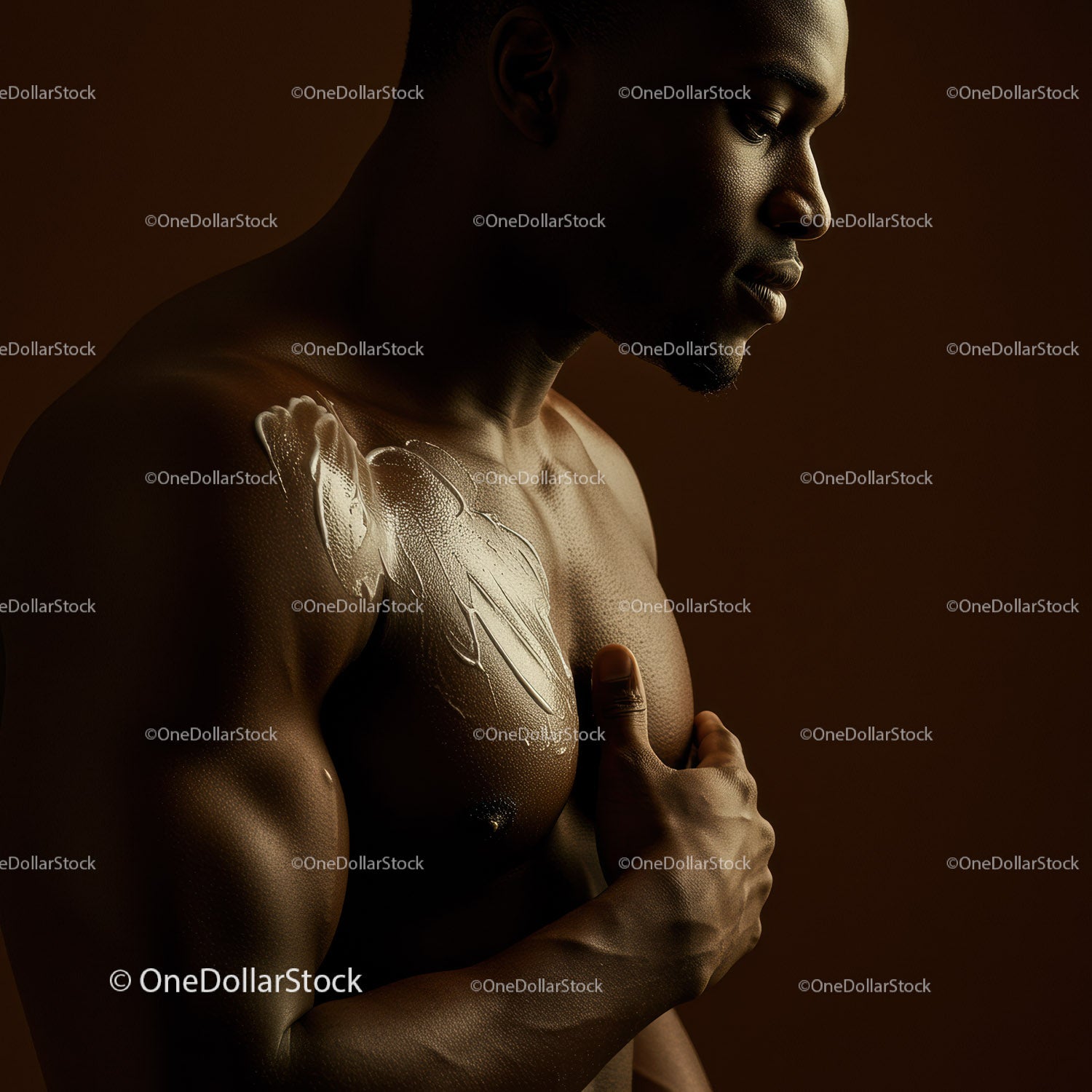 Artistic Portrait of an African American Man with Shoulder Tattoo and Dramatic Lighting