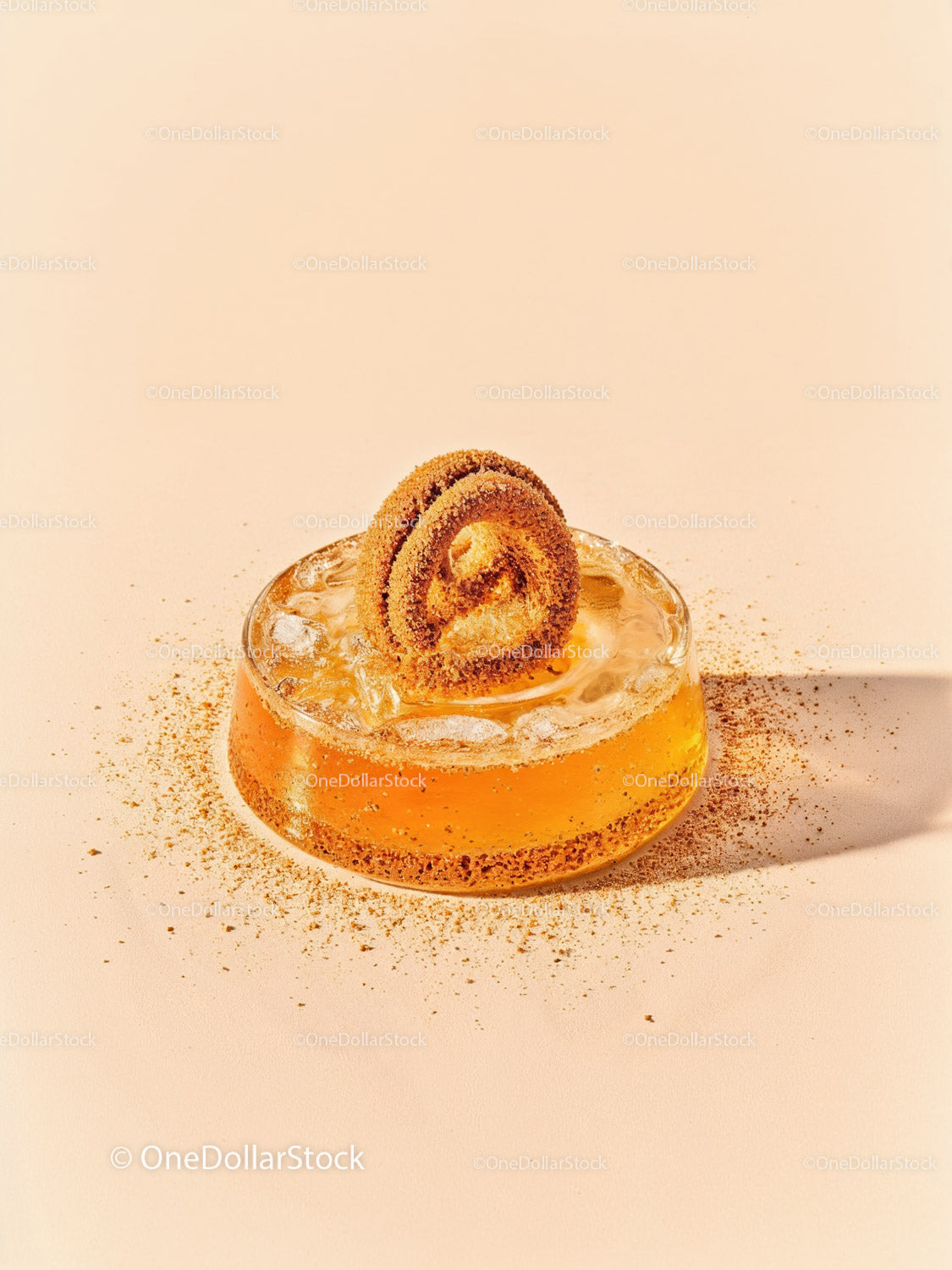 Refreshing amber cocktail with cinnamon sugar garnish
