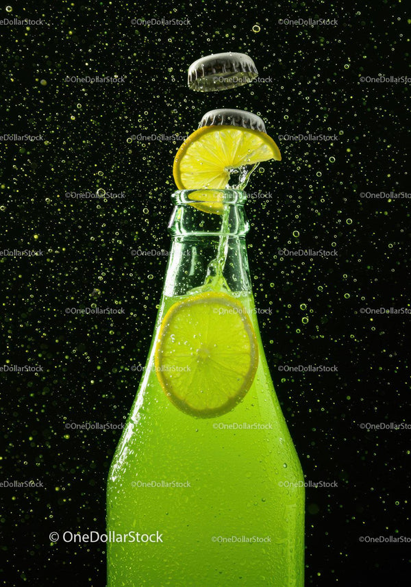 Refreshing lime soda with lemon slice and fizz bubbles