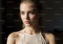 Portrait of a Beautiful Woman with Blue Eyes in Elegant Lace Top